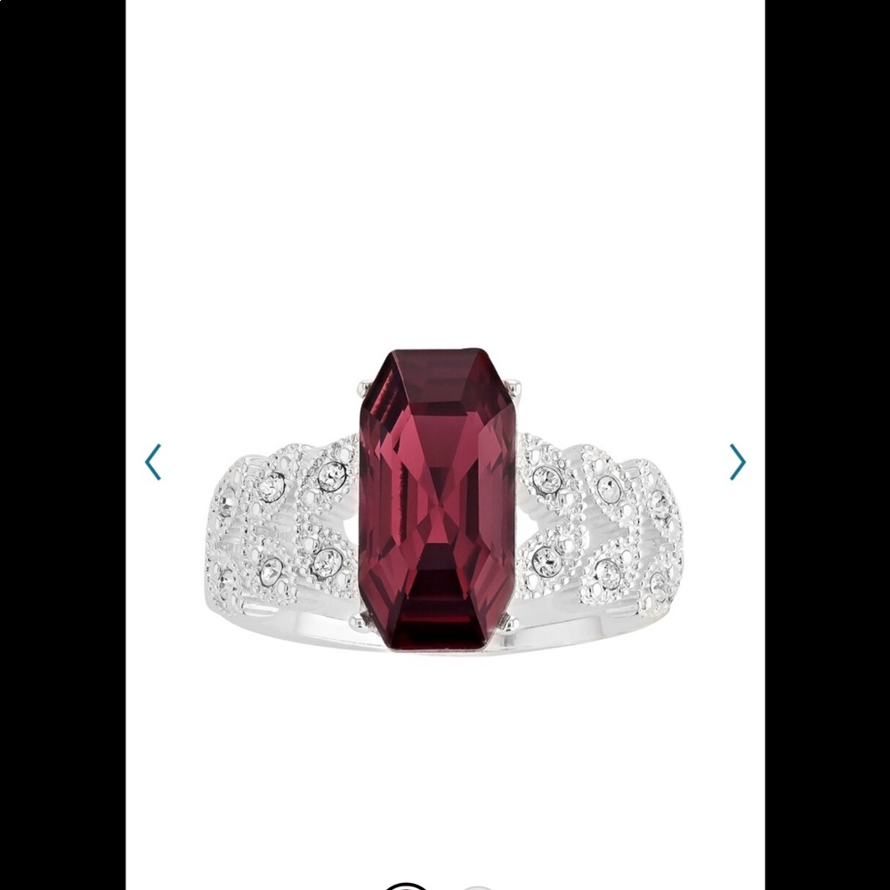New. Brilliance red emerald cut ring. Size 7